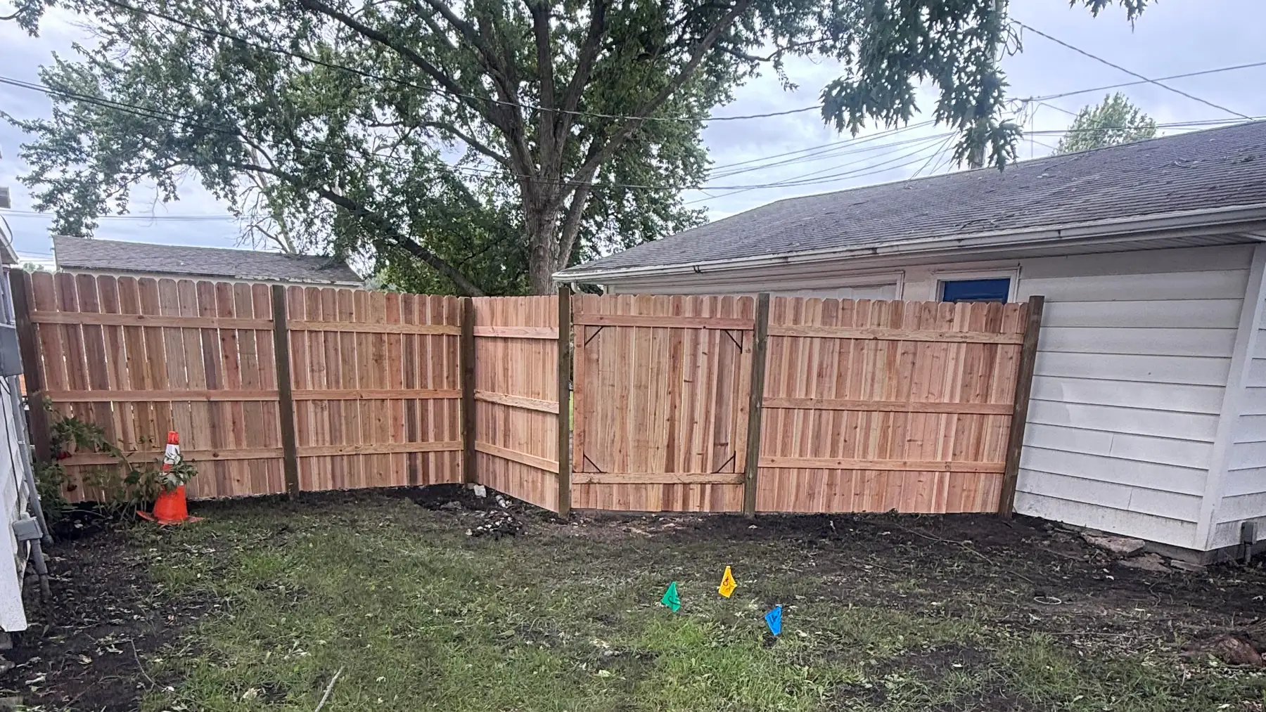Cedar board-on-board privacy fence and gate built by Precision Fence Co. in the Fort Dodge area